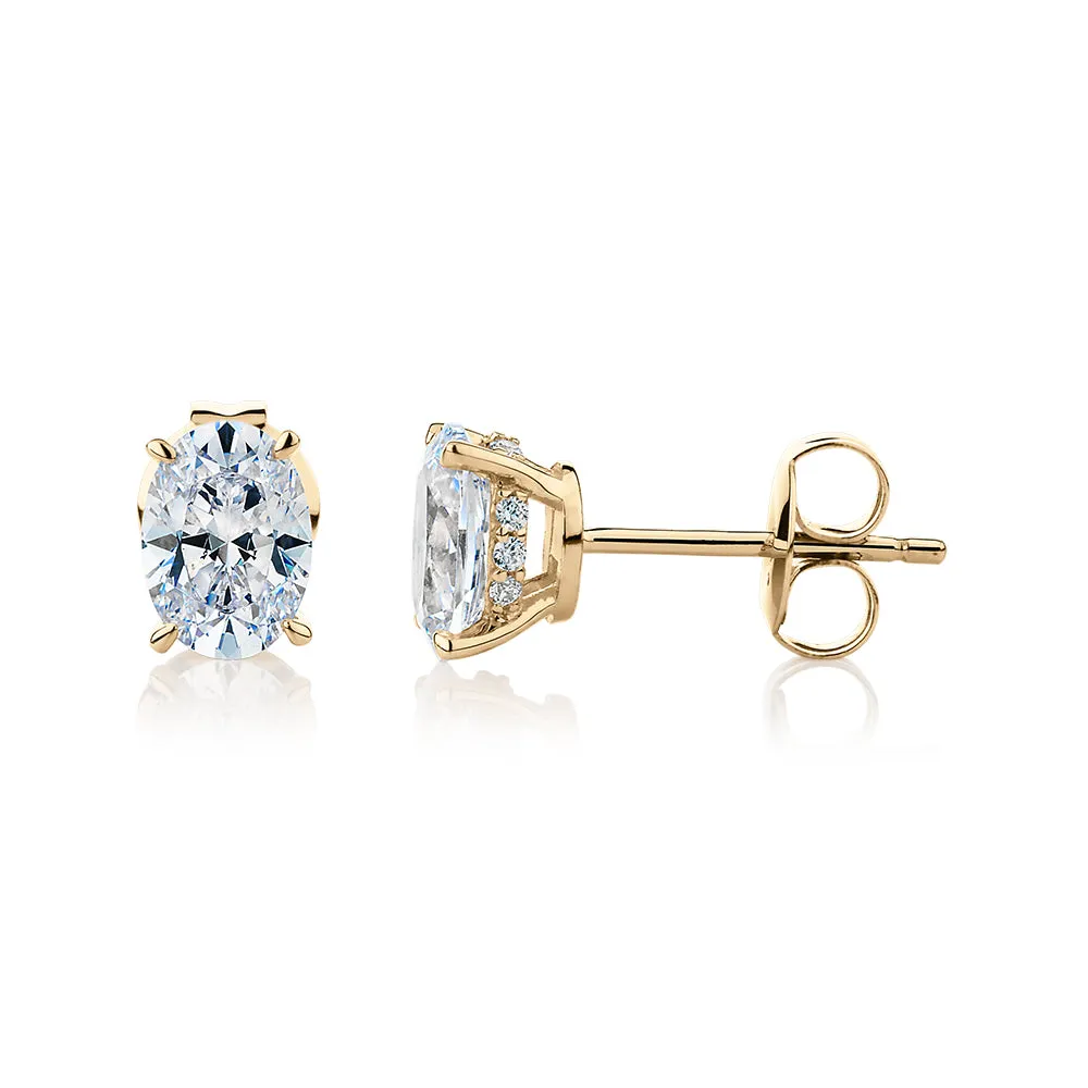 Oval stud earrings with 1.62 carats* of diamond simulants in 10 carat yellow gold
