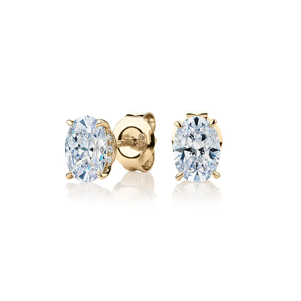 Oval stud earrings with 1.62 carats* of diamond simulants in 10 carat yellow gold