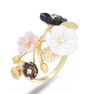 Ring in 925 silver gilded with 18k yellow gold assembled with mother-of-pearl, black and pink shell pearl and zirconium oxide
